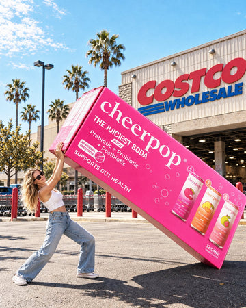 Oversized pink Cheerpop variety pack display outside a Costco warehouse.