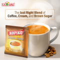 Kopiko Brown Coffee Mix sachet with a creamy coffee cup