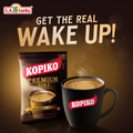 Kopiko Premium 3in1 coffee sachet beside a prepared cup of coffee