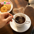 preparing hot instant black coffee in a white cup